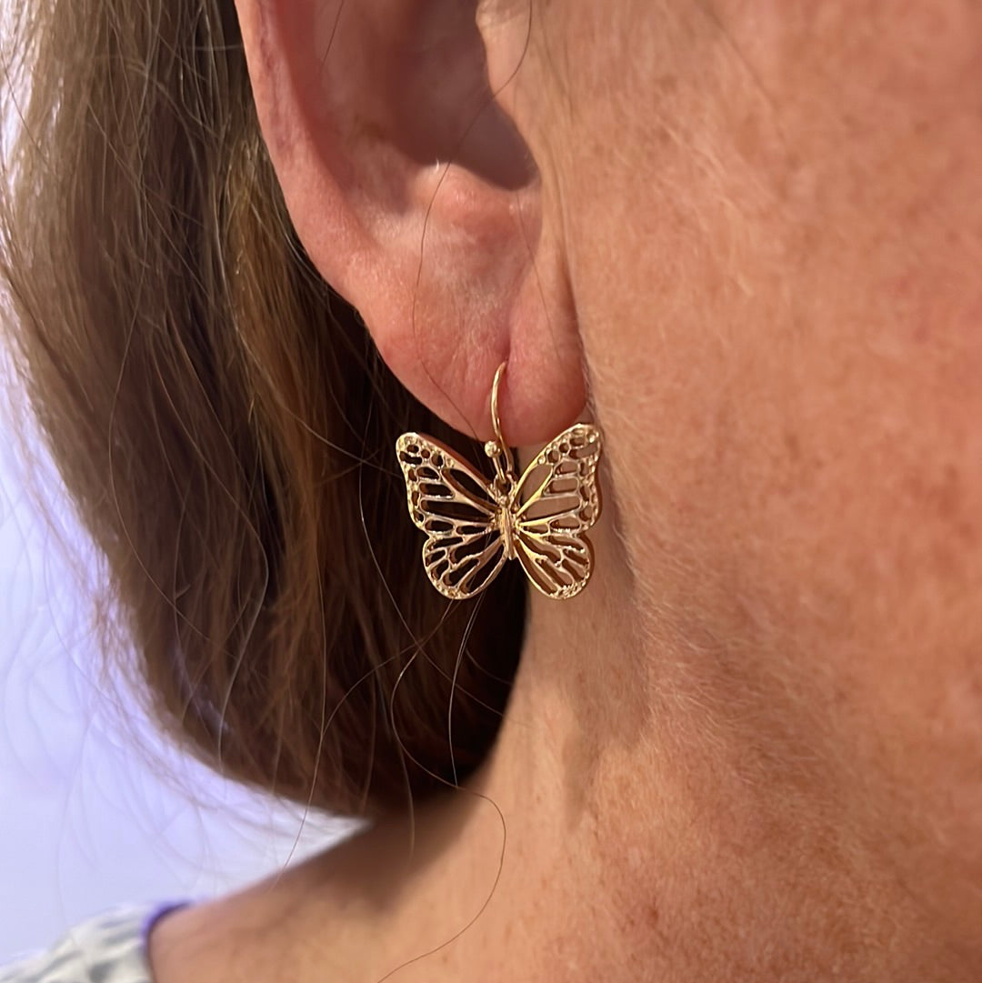 Gold dangle butterfly earrings.  Lead compliant.