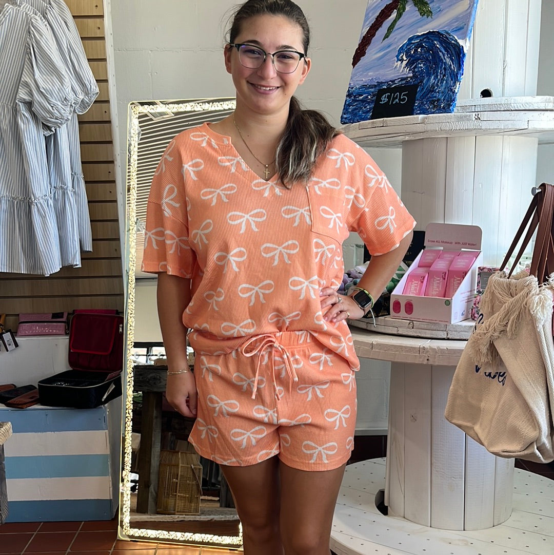 2 piece waffle summer set available in sizes Small through 2XL. Colors: Pink, Tangerine. Brand: Jady K. 65% Cotton, 35% Polyester. Tangerine