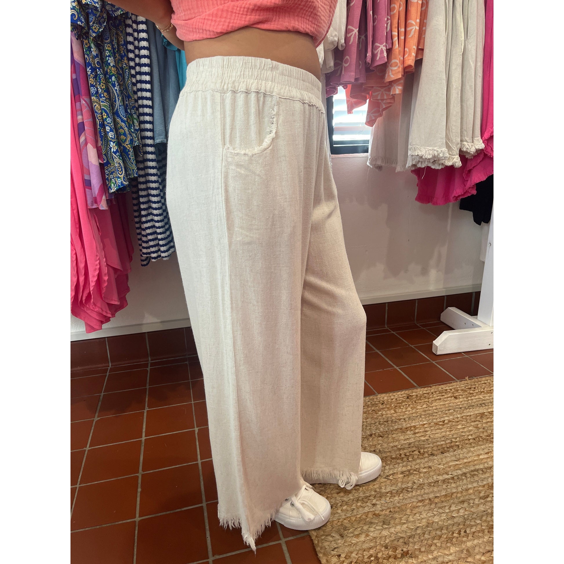 Wide leg pants with fray hems. Brand: Umgee. Available in sizes Small through Large. 55% Linen, 45% Cotton. Oatmeal