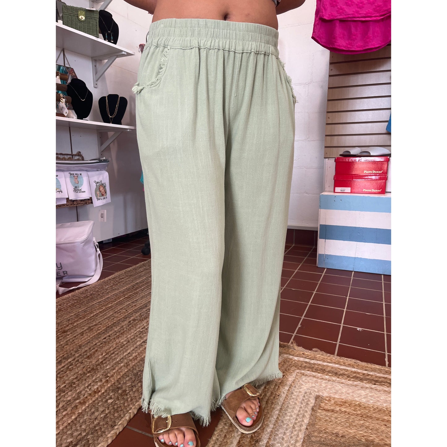 Wide leg pants with fray hems. Brand: Umgee. Available in sizes Small through Large. 55% Linen, 45% Cotton. Oatmeal