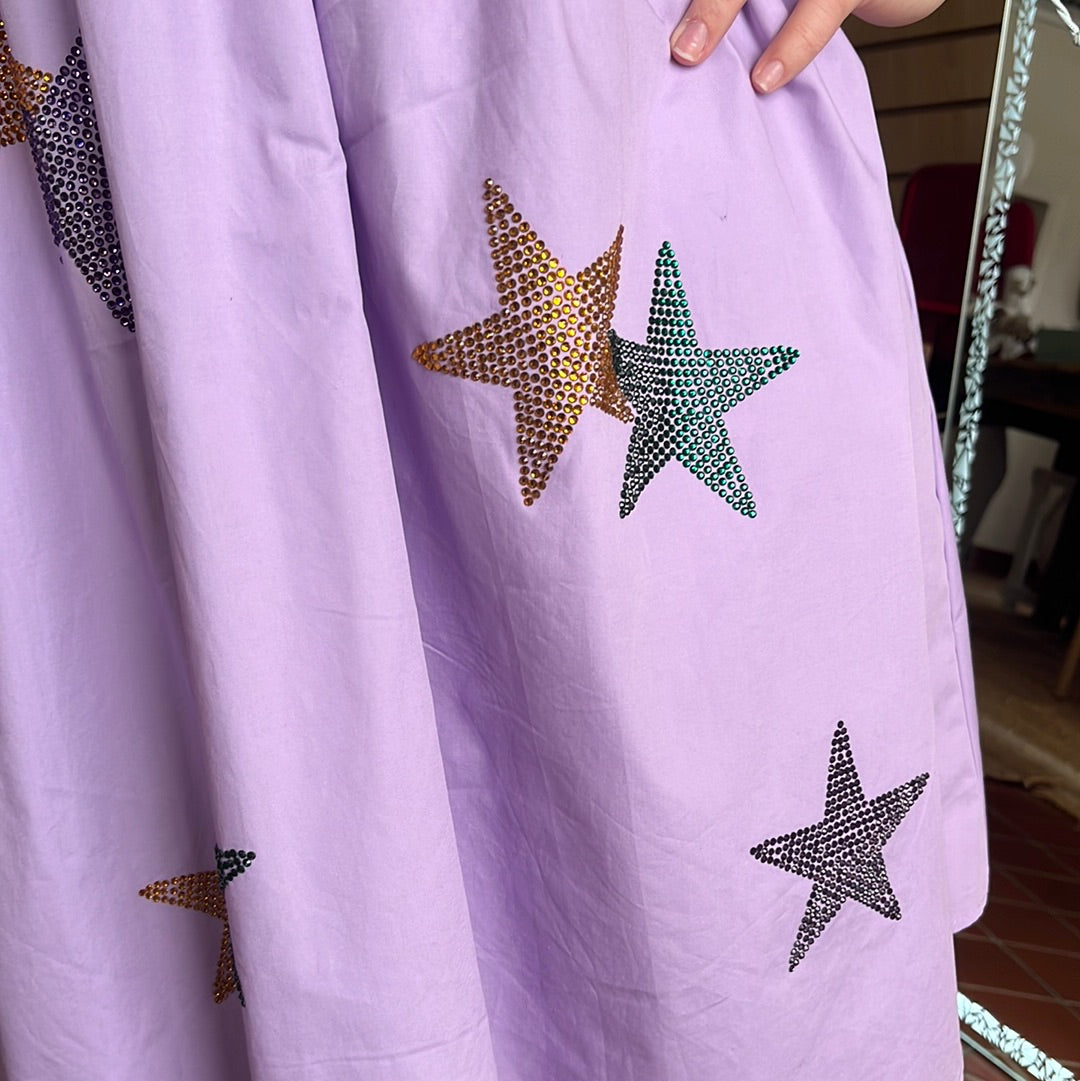 Lavender "Bling" Star Dress with ruffled sleeves, available in sizes Small through Large. Brand: Peach Love. Self: 100% Cotton Lining: 98% Polyester, 2% Spandex