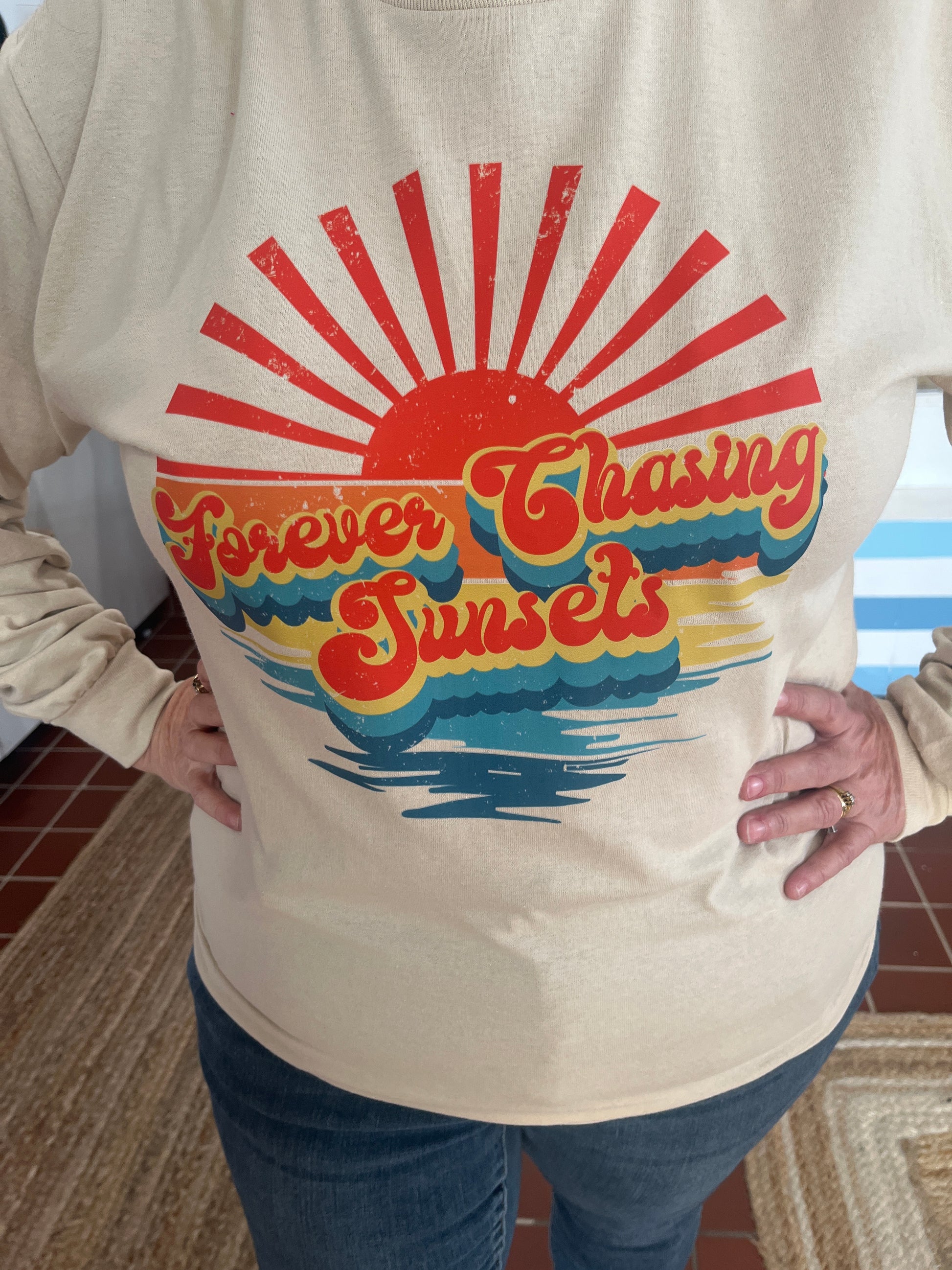 Plus size Forever Chasing Sunsets Graphic T available in Sizes 2X and 3X in Indigo Blue or Sand.  Long Sleeve.  100% Cotton