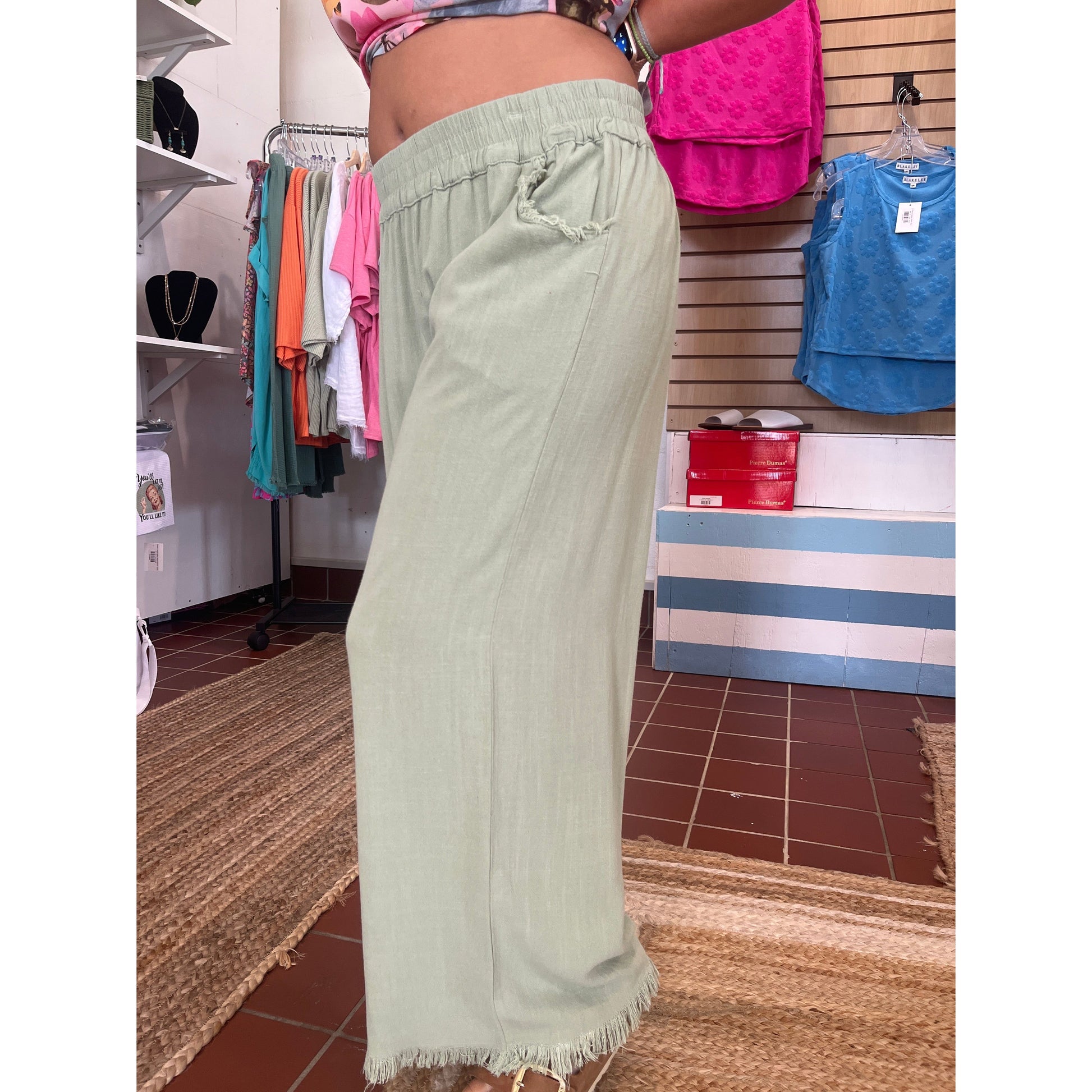 Wide leg pants with fray hems. Brand: Umgee. Available in sizes Small through Large. 55% Linen, 45% Cotton. Sage
