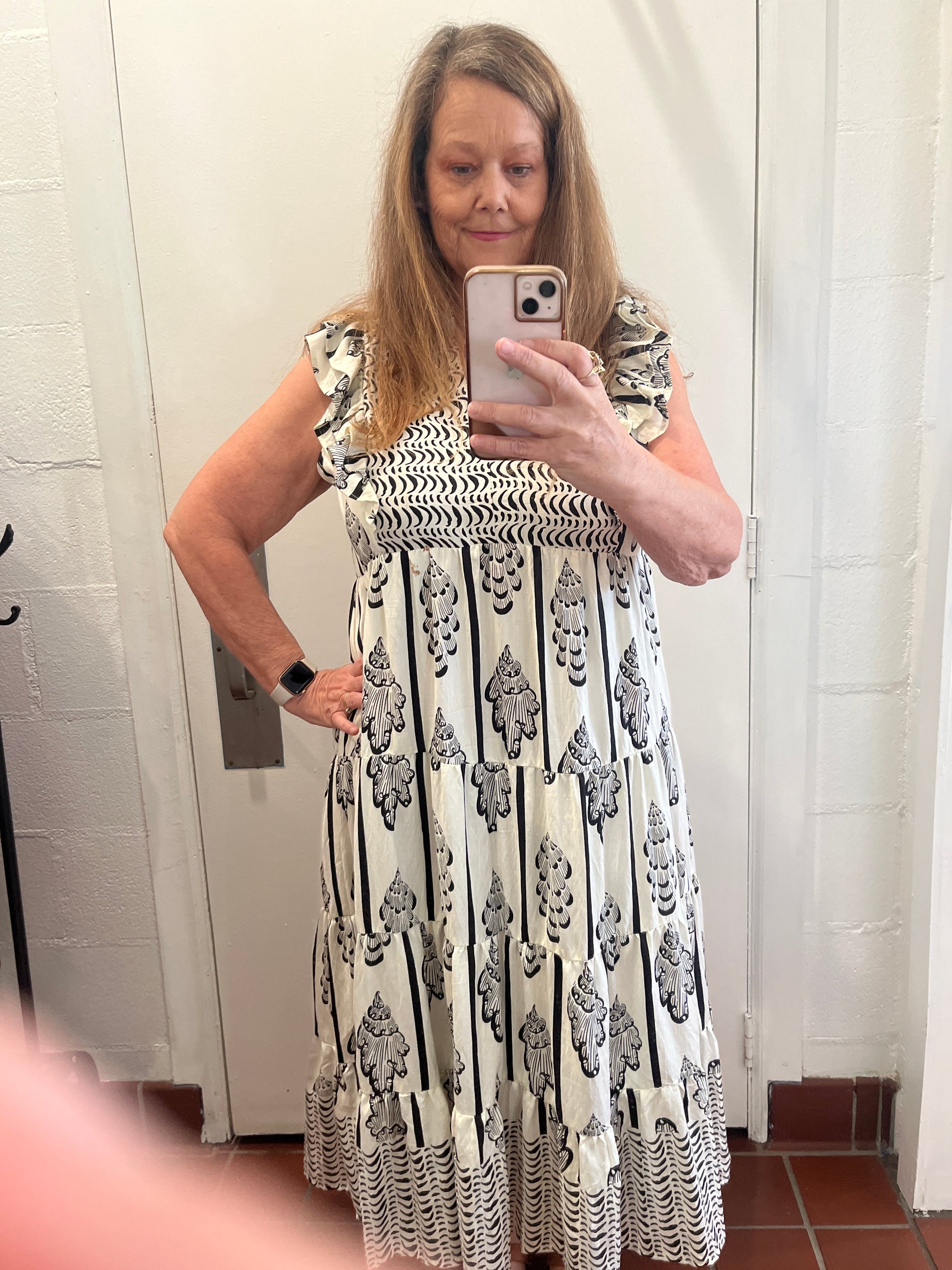 Plus size border print smocked dress available in sizes XL, 1X and 2X in Cream and Black and Cream and Sage.