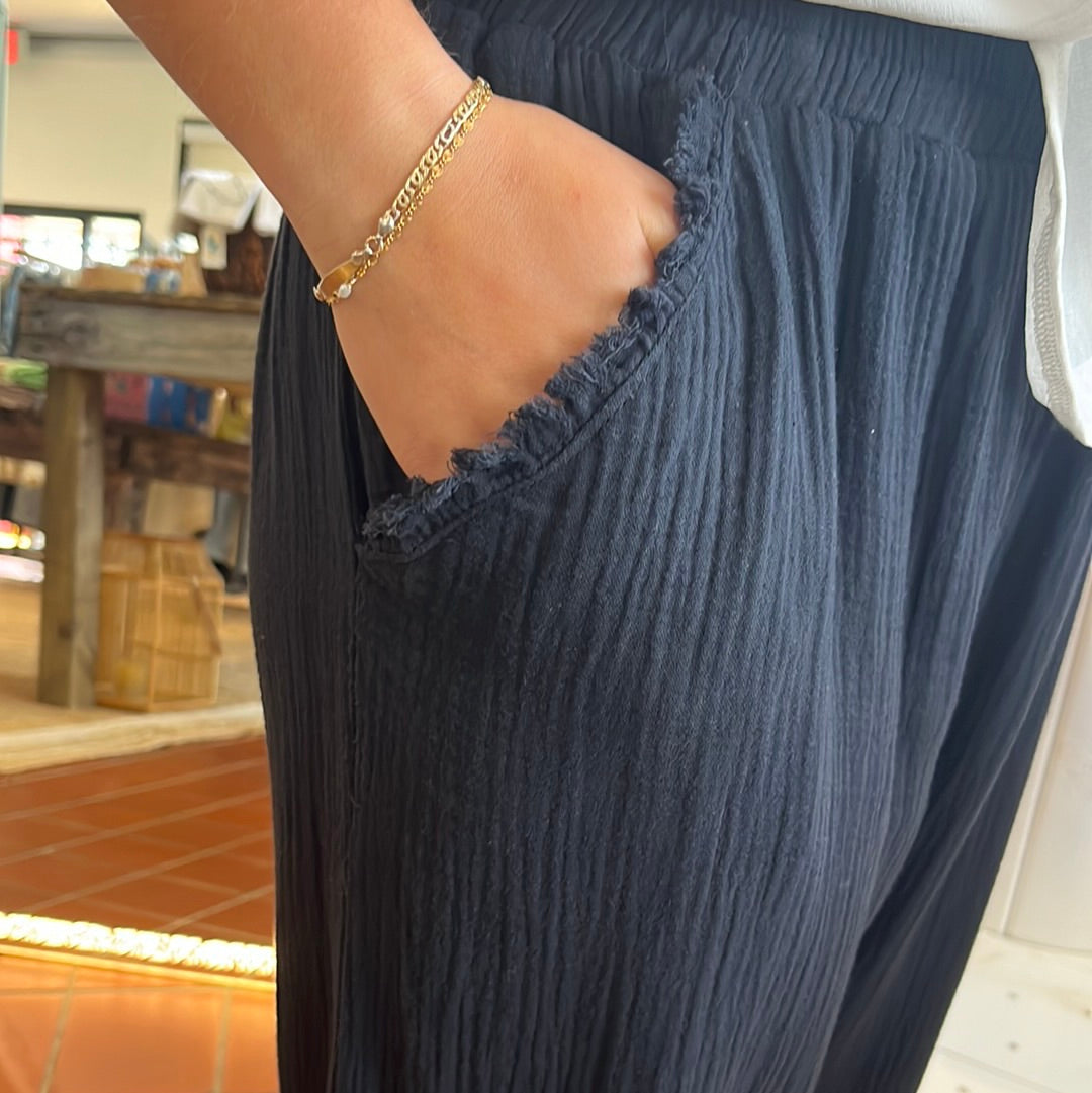 Umgee wide leg pants with fray, Available in sizes Small through Large.100% Cotton. Black.