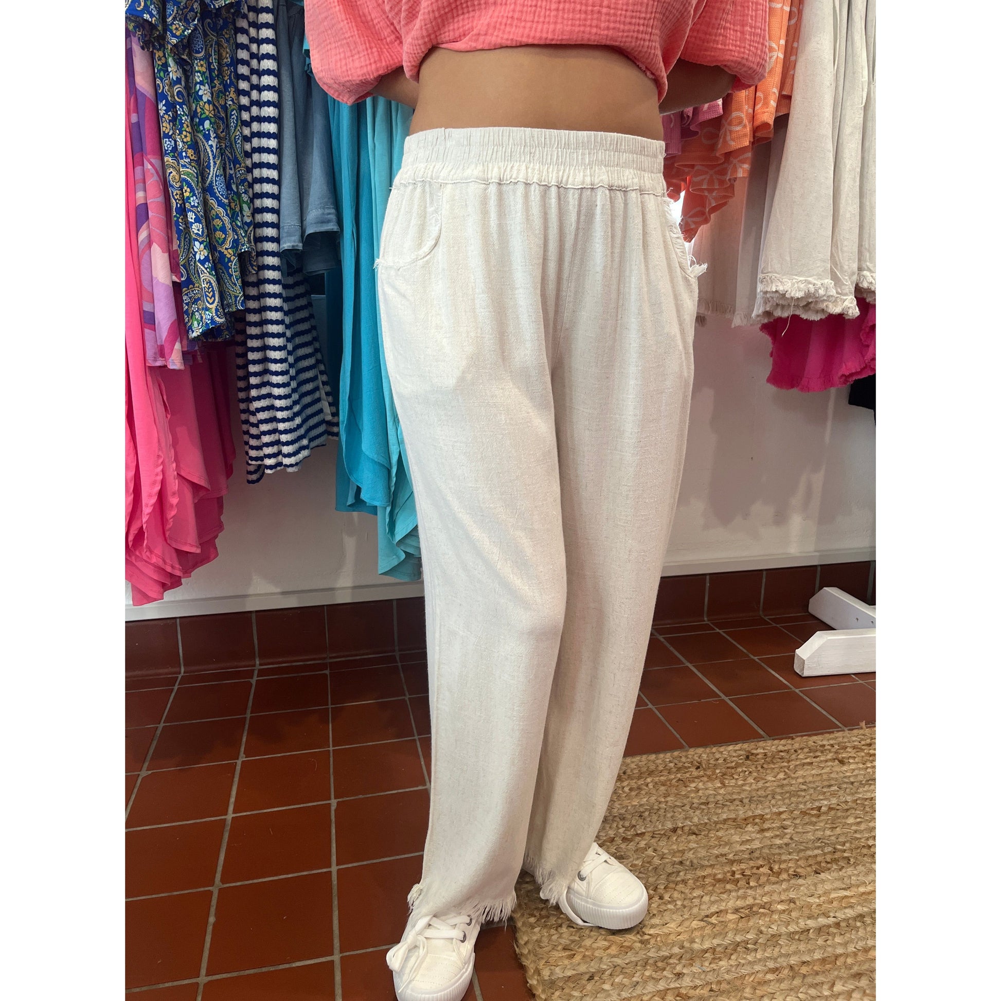 Wide leg pants with fray hems.  Brand: Umgee.  Available in sizes Small through Large.  55% Linen, 45% Cotton.  Oatmeal