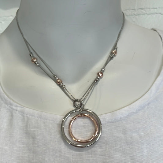 9" silver necklace with circle pendant.  Earrings included