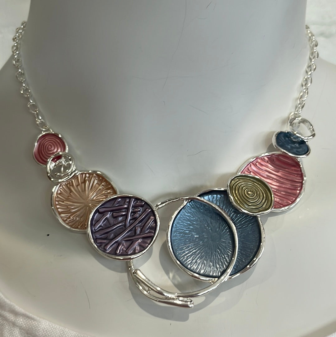 Silver necklace with purple, pink, and blue colorful disks with earrings