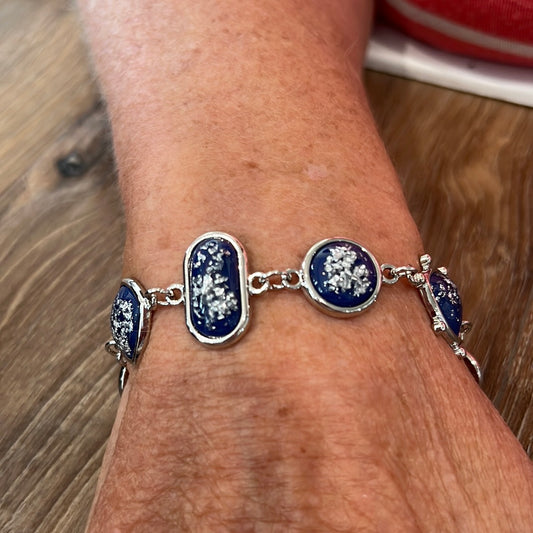 Striking Silver bracelet with blue and silver pendants