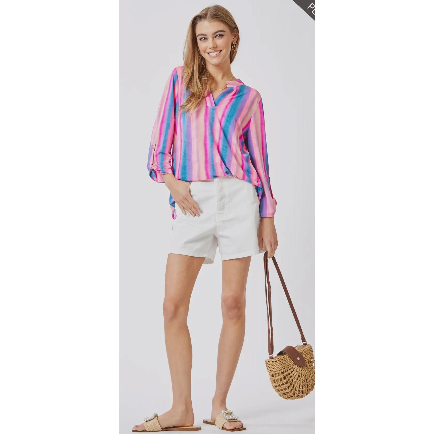 Pink, blue and purple vertically striped blouse with 3/4 rolled button sleeves.