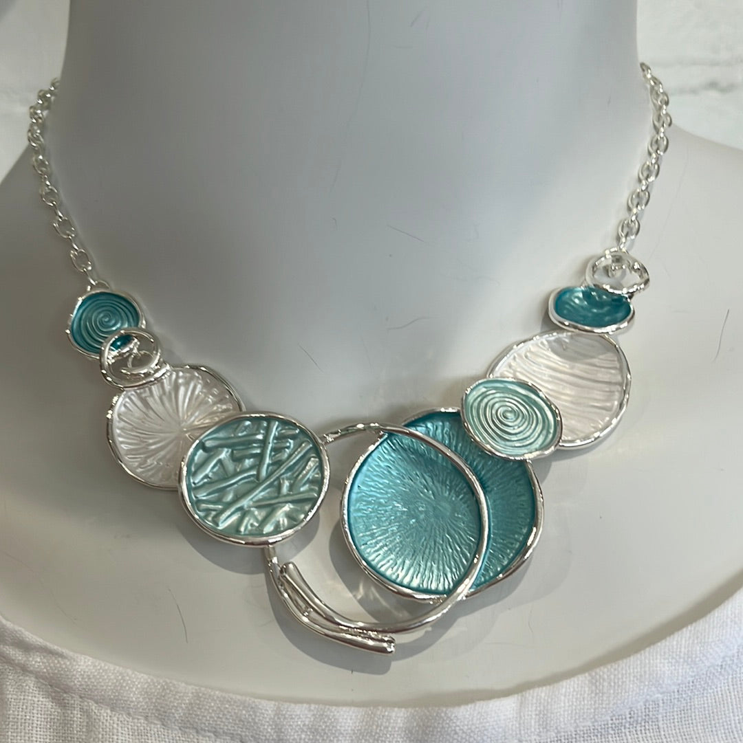 Silver necklace with blue and white colorful disks, with matching earrings