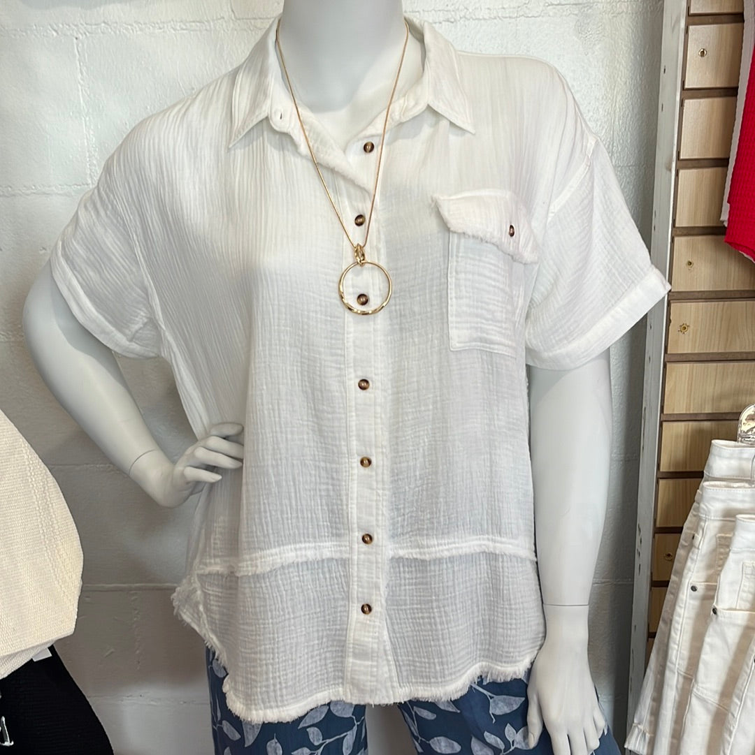 Plus size white gauze button down shirt available in sizes 1X-3X. 100% Cotton. Easel