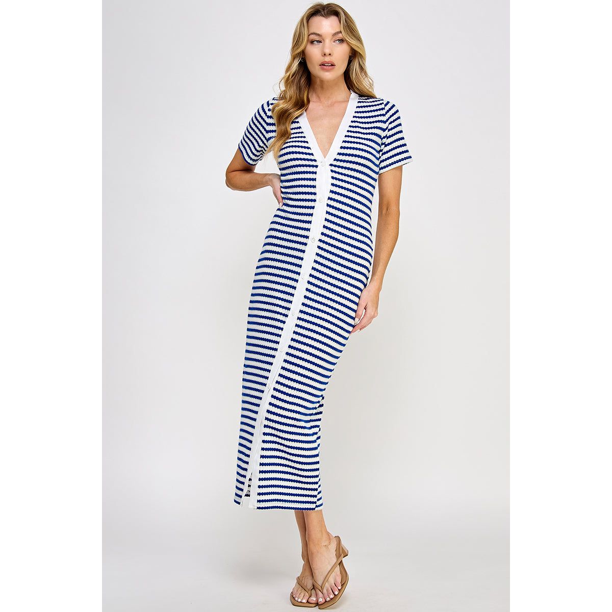V-Neck Button Down Knit Blue Dress available in sizes Small through Large. Brand: Ellison Apparel. 57% Polyester, 27% Acrylic , 11% Rayon, 5% Nylon.