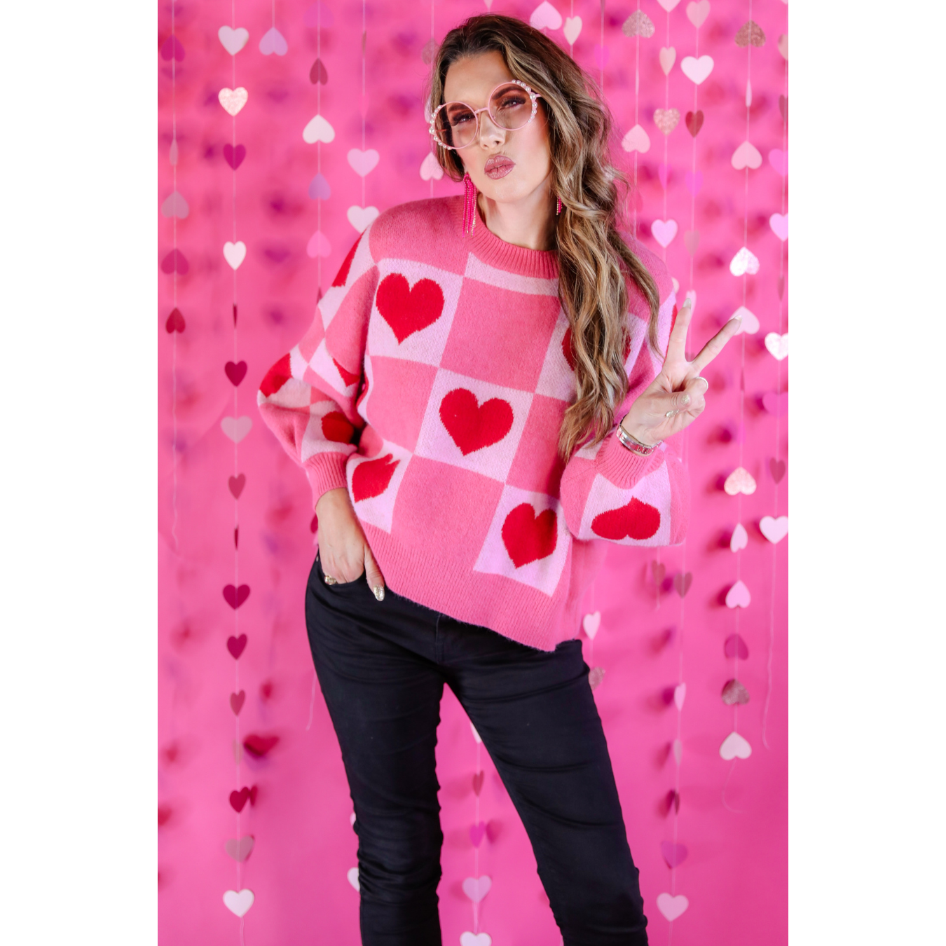 Layers of Love Heart Sweater by Jess Lea available in sizes Small through Large  Red hearts on pink squares.  Checkerboard pattern.  39% Acrylic, 31% Polyester, 30% Polyamide 