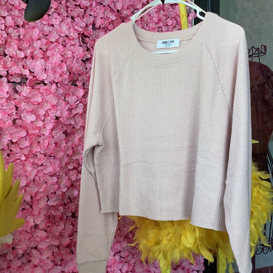 Cropped lightweight sweater, available in sizes Small through Large. 85% Polyester, 15% Rayon. Blush