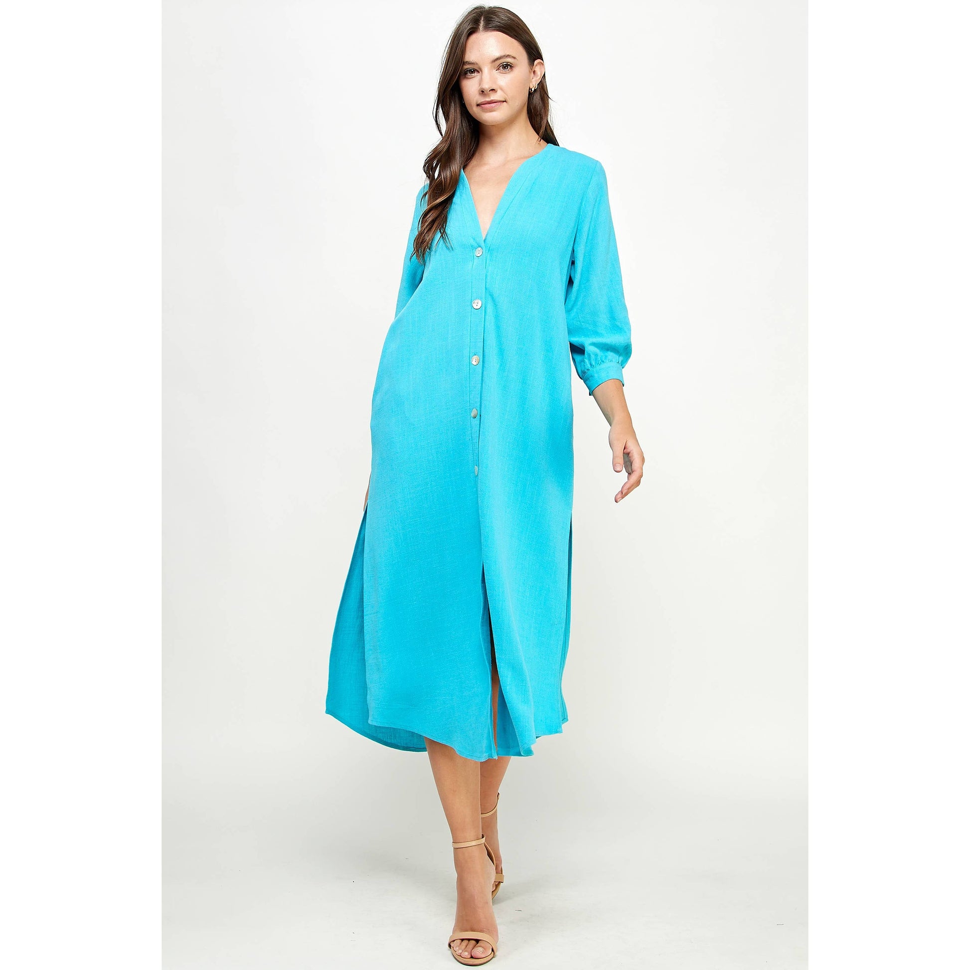 Blue V-Neck Button Down Linen Dress by Ellison Apparel. Available in sizes Small through Large. 70% Viscose, 30% Linen.